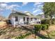 Wide view of backyard showing manicured lawn, patio, garden, and fence at 640 Intracoastal Way # 640, Myrtle Beach, SC 29579