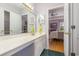 Bathroom vanity with long countertop, good lighting, and open access to the main bedroom at 640 Intracoastal Way # 640, Myrtle Beach, SC 29579