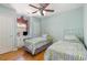 Bedroom featuring twin beds, a desk, a ceiling fan, and wood floors at 640 Intracoastal Way # 640, Myrtle Beach, SC 29579
