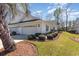 Villa featuring pristine white facade, garage, and manicured landscaping at 640 Intracoastal Way # 640, Myrtle Beach, SC 29579