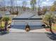 Charming villa with a pristine white facade, dual garages, and lush palm trees at 640 Intracoastal Way # 640, Myrtle Beach, SC 29579