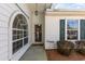 Front entrance with an arched window, storm door, and a 'Tranquility' sign at 640 Intracoastal Way # 640, Myrtle Beach, SC 29579