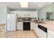 Functional kitchen with white appliances, ample cabinet space, and tile flooring at 640 Intracoastal Way # 640, Myrtle Beach, SC 29579