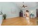 An airy living room features wood flooring, tall ceilings, and access to the sunroom at 640 Intracoastal Way # 640, Myrtle Beach, SC 29579