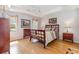 Comfortable main bedroom with two windows, stylish ceiling fan, and hardwood floors at 640 Intracoastal Way # 640, Myrtle Beach, SC 29579