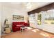 Sunroom featuring a red sofa, tile floors, and plenty of natural light at 640 Intracoastal Way # 640, Myrtle Beach, SC 29579