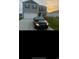 Beautiful two-story home with well-kept lawn and paved driveway featuring a sporty black car at 645 Black Pearl Way, Myrtle Beach, SC 29588