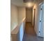 Bright hallway with neutral tones, carpet flooring and multiple doorways to bedrooms and other living spaces at 645 Black Pearl Way, Myrtle Beach, SC 29588