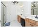 Bright bathroom with double sink vanity, decorative lighting and a large walk-in shower at 676 Johnson Ave., Myrtle Beach, SC 29577