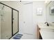 Bright bathroom with single sink vanity and walk-in shower with tile flooring at 676 Johnson Ave., Myrtle Beach, SC 29577