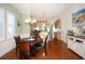 Charming dining area featuring hardwood floors and an elegant chandelier at 676 Johnson Ave., Myrtle Beach, SC 29577