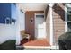 Front porch with brown siding, a welcome mat, and a chair at 676 Johnson Ave., Myrtle Beach, SC 29577