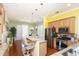 Open concept kitchen with stainless steel appliances and bar that connects to dining area at 676 Johnson Ave., Myrtle Beach, SC 29577