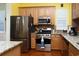 Bright kitchen with stainless steel appliances, hardwood floors and granite countertops at 676 Johnson Ave., Myrtle Beach, SC 29577