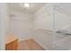 Walk-in closet with wire shelving for organized storage and a wood floor at 6904 Gina Ct., Myrtle Beach, SC 29588