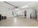 Spacious garage featuring painted floors, laundry, storage cabinets, sink, and water heater at 6904 Gina Ct., Myrtle Beach, SC 29588