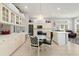 Bright kitchen featuring white cabinetry, tile flooring, stainless appliances, and breakfast area at 6904 Gina Ct., Myrtle Beach, SC 29588