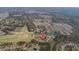 Wide aerial view of a neighborhood showing many homes and its central location near wooded areas and water at 6904 Gina Ct., Myrtle Beach, SC 29588