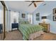 Comfortable bedroom featuring soft blue walls, carpet floors, and a ceiling fan at 74 Dornoch Dr., Pawleys Island, SC 29585