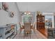 Charming dining room with a round table, hardwood floors, and a display cabinet at 74 Dornoch Dr., Pawleys Island, SC 29585