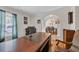 Spacious office featuring a large wooden desk and a comfortable leather chair at 74 Dornoch Dr., Pawleys Island, SC 29585