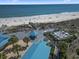 Overhead view of the beach and a boardwalk with seating and palm trees at 77 Tern Pl. # 202, Pawleys Island, SC 29585