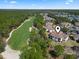 An aerial view of a home next to a golf course shows proximity to community amenities at 77 Tern Pl. # 202, Pawleys Island, SC 29585