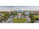 Stunning aerial view of building exterior, grounds, landscaping, and the ocean beach at 77 Tern Pl. # 202, Pawleys Island, SC 29585