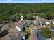 An aerial view shows the neighborhood near a lush golf course and landscaped grounds at 77 Tern Pl. # 202, Pawleys Island, SC 29585