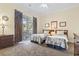 Cozy bedroom with two twin beds and sliding glass doors to the balcony with a view at 77 Tern Pl. # 202, Pawleys Island, SC 29585