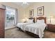 Bright bedroom featuring two twin beds, a serene ambiance and natural light for comfort and relaxation at 77 Tern Pl. # 202, Pawleys Island, SC 29585