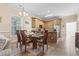 Charming kitchen with wooden cabinets, stainless steel appliances, adjacent to dining table, offering functionality and style at 77 Tern Pl. # 202, Pawleys Island, SC 29585