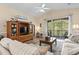 Cozy living room with wood floors and sliding door to screened porch at 77 Tern Pl. # 202, Pawleys Island, SC 29585