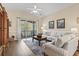 Comfortable living room with bright decor and sliding door to screened porch at 77 Tern Pl. # 202, Pawleys Island, SC 29585