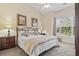 Relaxing bedroom featuring a plush king-size bed, soft lighting, and tasteful decor for a peaceful retreat at 77 Tern Pl. # 202, Pawleys Island, SC 29585