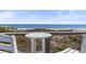 Enjoy ocean views from the balcony with a small table between two chairs at 77 Tern Pl. # 202, Pawleys Island, SC 29585