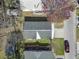 Aerial perspective of neighborhood homes with tarped roofs, nestled among mature trees at 909 Pine Thicket St., Myrtle Beach, SC 29577