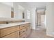 Modern bathroom with double sinks, wood cabinets, and a glass shower at 909 Pine Thicket St., Myrtle Beach, SC 29577