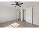 Bedroom with light-colored floor, fan, and doors to closet spaces at 909 Pine Thicket St., Myrtle Beach, SC 29577