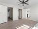 Spacious bedroom features a ceiling fan and multiple doorways that lead to other rooms and closets at 909 Pine Thicket St., Myrtle Beach, SC 29577