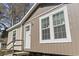 Charming home exterior with neutral siding, white trim, and inviting front steps at 909 Pine Thicket St., Myrtle Beach, SC 29577