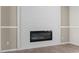 Inviting living room showcasing a modern electric fireplace and light hardwood floors at 909 Pine Thicket St., Myrtle Beach, SC 29577