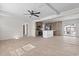 Open concept living space with wood floors, ceiling fan, and an opening to the kitchen at 909 Pine Thicket St., Myrtle Beach, SC 29577