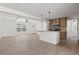 Open-concept living room and kitchen area with lots of natural light at 909 Pine Thicket St., Myrtle Beach, SC 29577