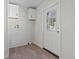 Clean mud room featuring white cabinetry and an exterior door for easy access at 909 Pine Thicket St., Myrtle Beach, SC 29577