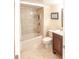 Cozy bathroom featuring tiled shower over tub and wooden vanity at 9820 Queensway Blvd. # 1210, Myrtle Beach, SC 29572