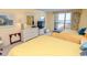 Sunny bedroom featuring two beds, a white dresser, and access to a balcony with ocean views at 9820 Queensway Blvd. # 1210, Myrtle Beach, SC 29572