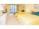 Inviting bedroom featuring two beds, a dresser, and views of the city from a private balcony at 9820 Queensway Blvd. # 1210, Myrtle Beach, SC 29572