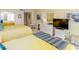 Bright bedroom featuring two beds, dresser with mirror, TV and sliding door closet at 9820 Queensway Blvd. # 1210, Myrtle Beach, SC 29572