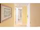 Hallway view with art leading to a bathroom with tiled shower and curtain at 9820 Queensway Blvd. # 1210, Myrtle Beach, SC 29572